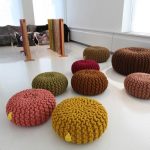 Many round poufs for outdoor seating