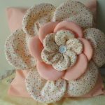Delicate pillow with rose in pastel colors