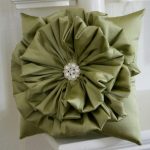Flower pillow with brooch