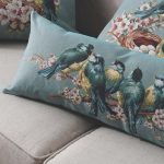 Pillow with flowers and birds for the interior of the living room in the style of Provence