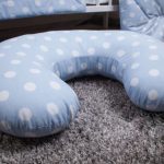 Polka dot pillow complete with bedding in the crib