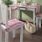 Striped chair cushions and tablecloth in one color