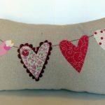 Rectangular pillow case with heart-shaped appliqué
