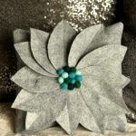 Gray pillow in the shape of a flower