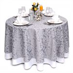 Elegant long round tablecloth on the festive table