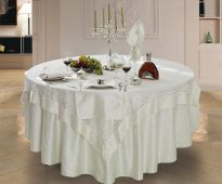 Elegant square tablecloth on a round table