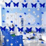 Beautiful butterflies on the curtains in the doorway
