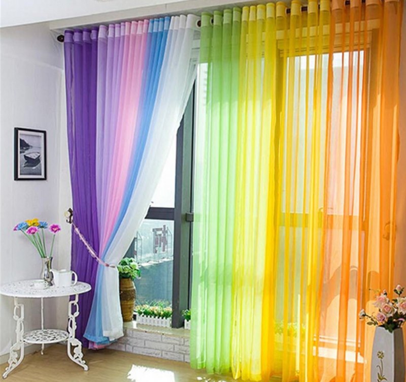 Multicolor curtain on the bedroom window with balcony