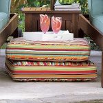 Comfortable striped summer pillows on the floor