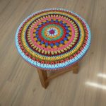 Knitted cushion-pad on a round stool