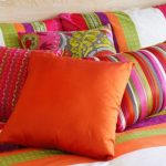 Bright decorative pillows in the bedroom interior