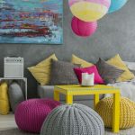 Bright interior cushions make it easy to change the interior of a simple room.