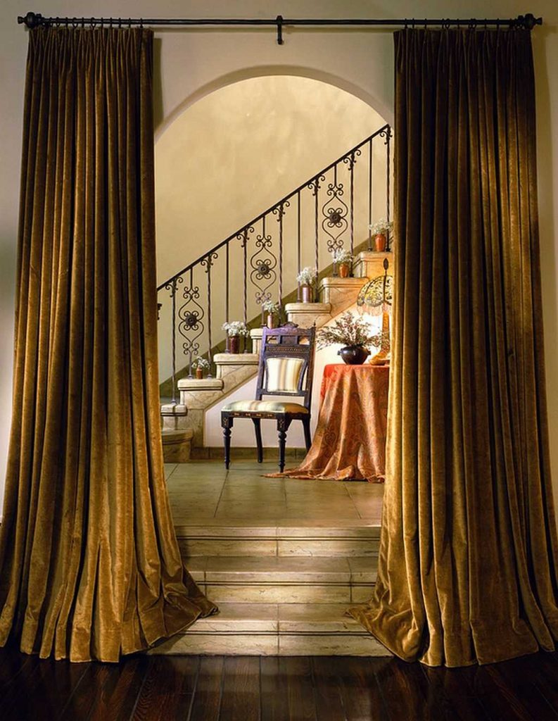 Velvet curtains sa arched doorway