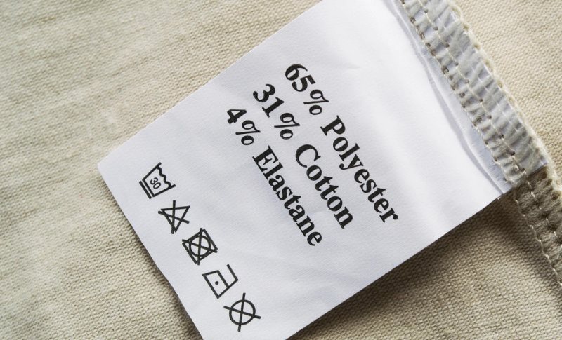 Label with symbols on a curtain of composite material