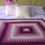 Large plaid on a double bed in the form of a large square
