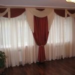 Burgundy beige curtains at two-window tulle