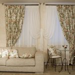 Floral curtains and pillows for a room with two small windows