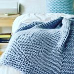 Blue warm knitted blanket with hearts