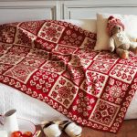 Red and white blanket with different patterns