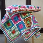 Cape on the stool and pillow in the same style of squares