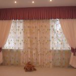 Delicate curtains for two windows in the nursery