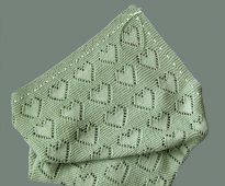 Very beautiful and gentle plaid for newborns with openwork hearts