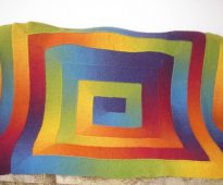 Rainbow blanket on the couch 10 loops