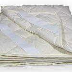 The most popular option is a mattress pad with elastic bands that cling to the corners of the mattress.