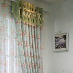 Country style curtains on a round cornice