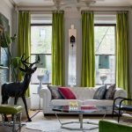 Curtains of lush green in the room with two windows