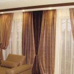 Dark brown curtains in the living room with two windows