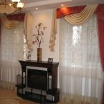 Tulle, curtains and pelmet for a room with two windows and a fireplace in between