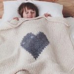 Knitted baby blanket with one big heart