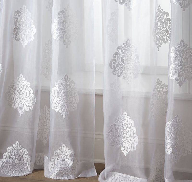 Synthetic bright white tulle with ornament