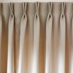 Bow pleat on beige curtain