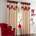 Beige curtains with poppies on the grommet