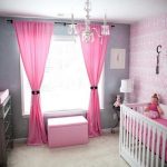 Pink curtains in the room for a newborn