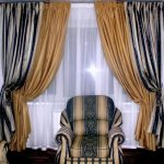 Three-color curtains on the window with white tulle