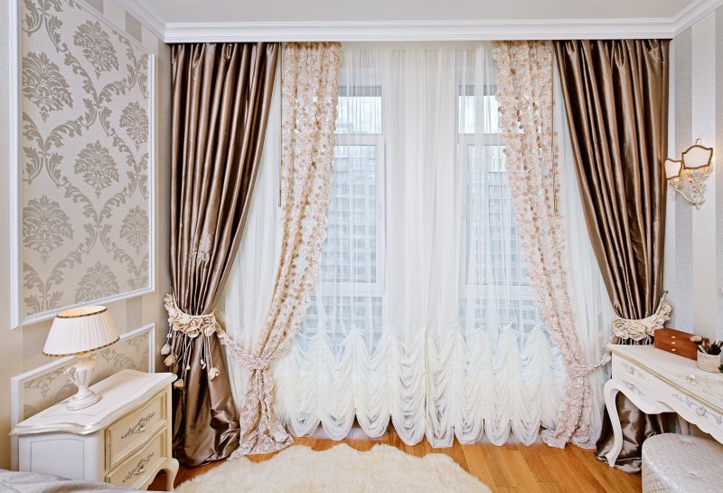 Combined curtains on the window in a city apartment