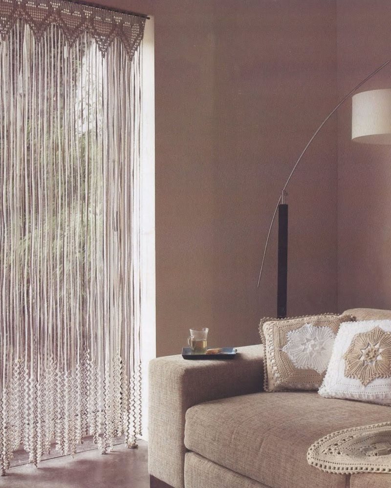 Living room design with a cotton curtain in the doorway