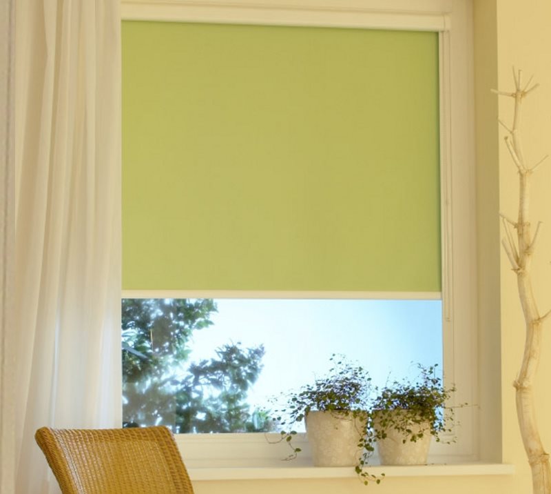 Light green roller blind with side guides