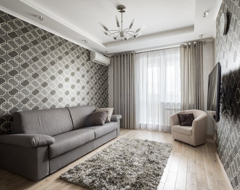 Interiér moderního obývacího pokoje v šedých odstínech.
