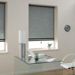 Gray blinds in the room with white walls