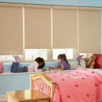 Beige roller blinds in the children's room
