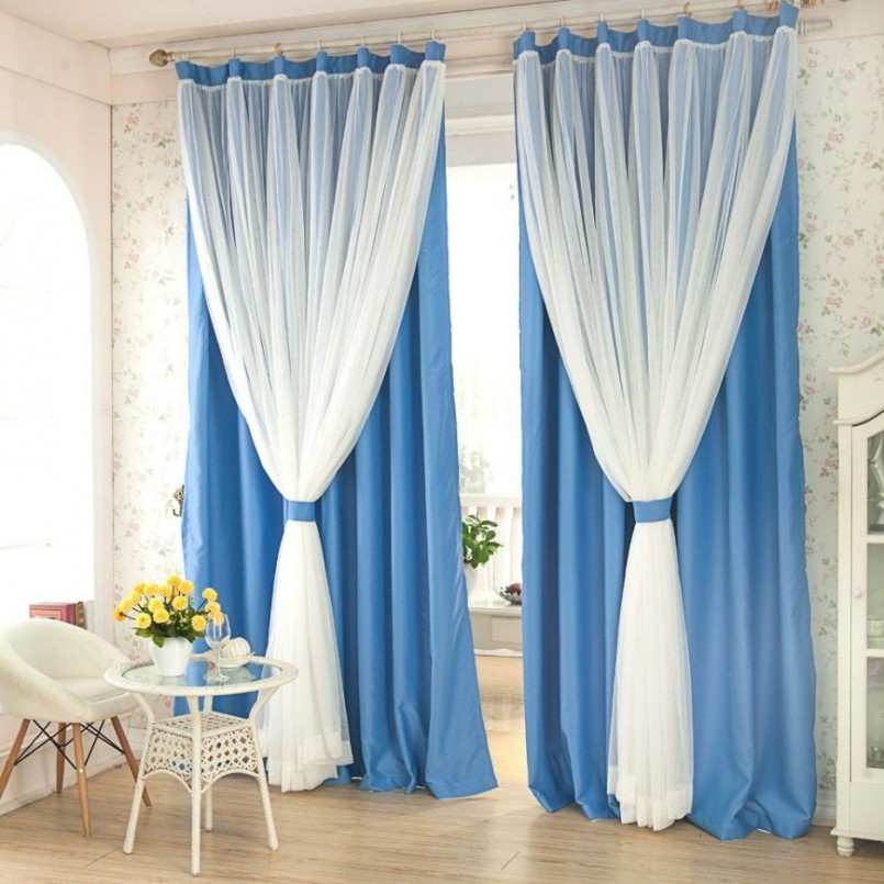 White tulle on one ledge with blue curtains