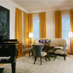 Yellow curtains in the living room with a grand piano