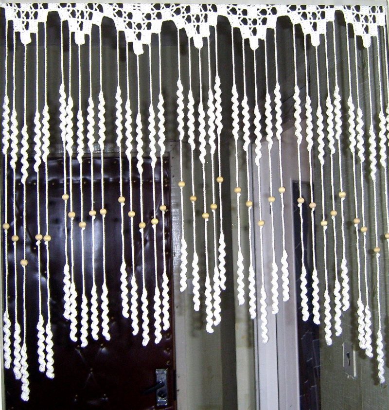 Knitted curtain for decorating the doorway with your own hands