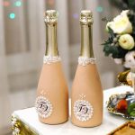 decoration of champagne bottles for a wedding photo decor