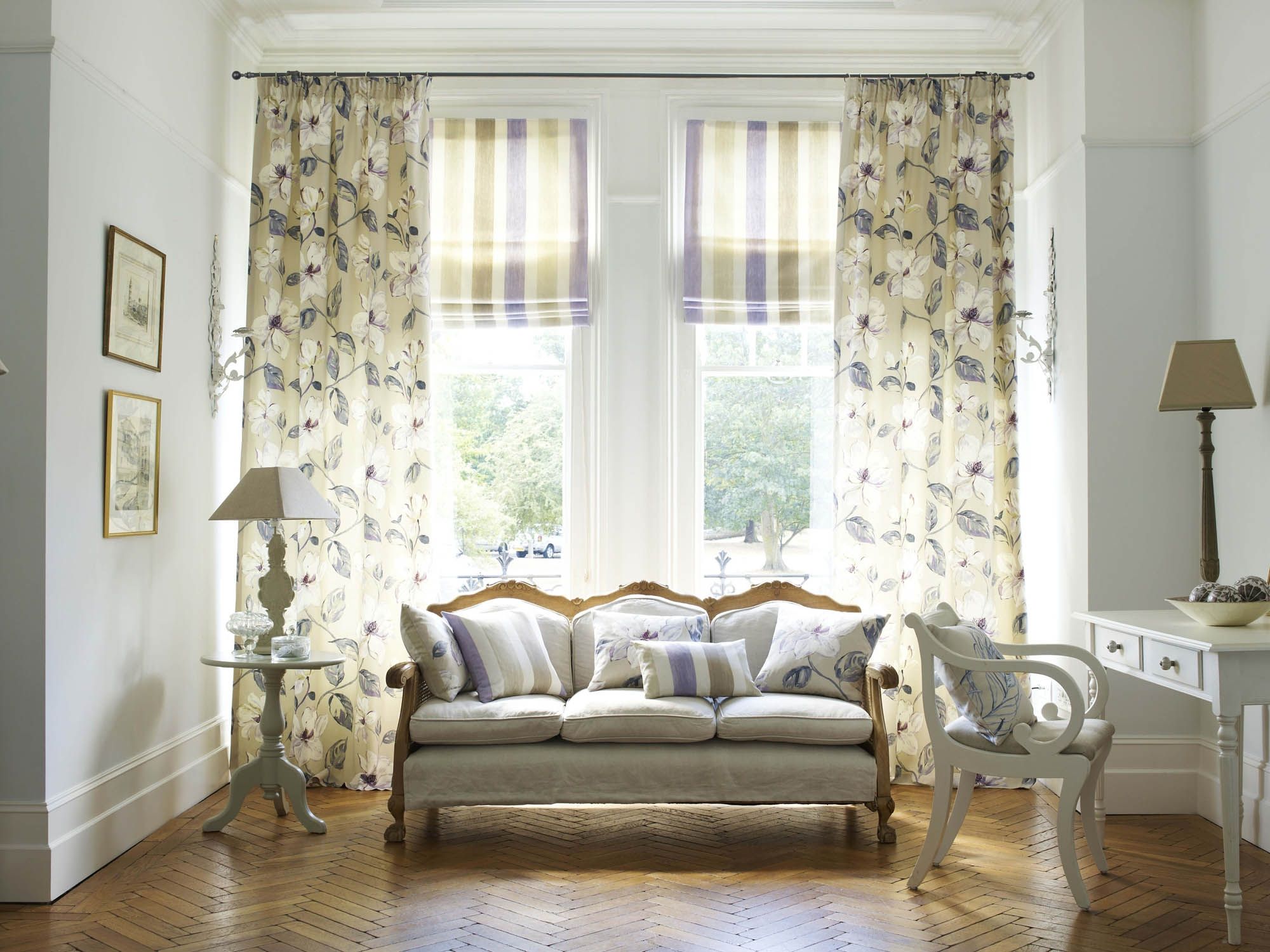 a combination of curtains in the living room
